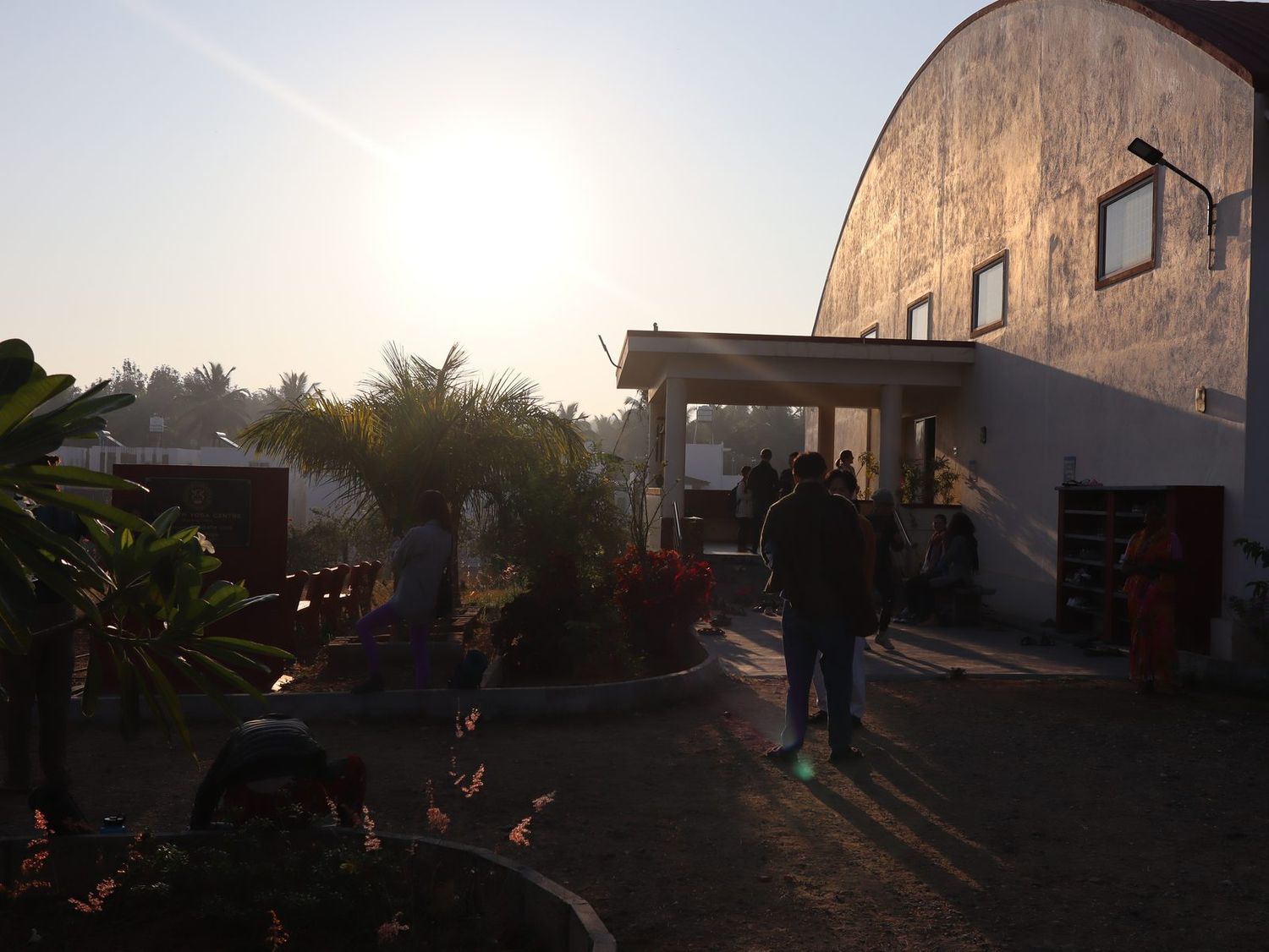 Students gathering at sunrise outside the Sharath Yoga Centre in Mysore